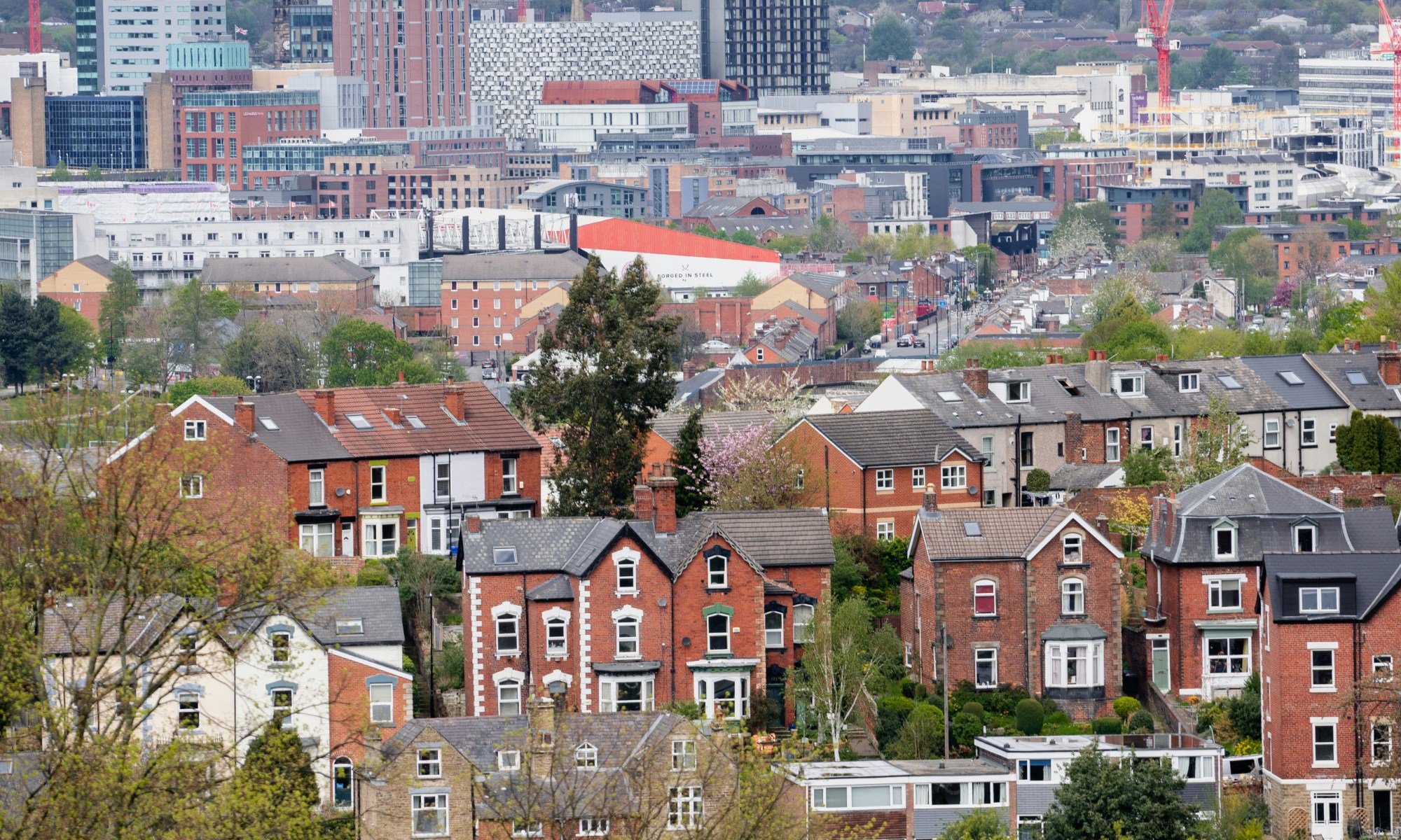 A skyline view of Sheffield, UK including residential buildings.